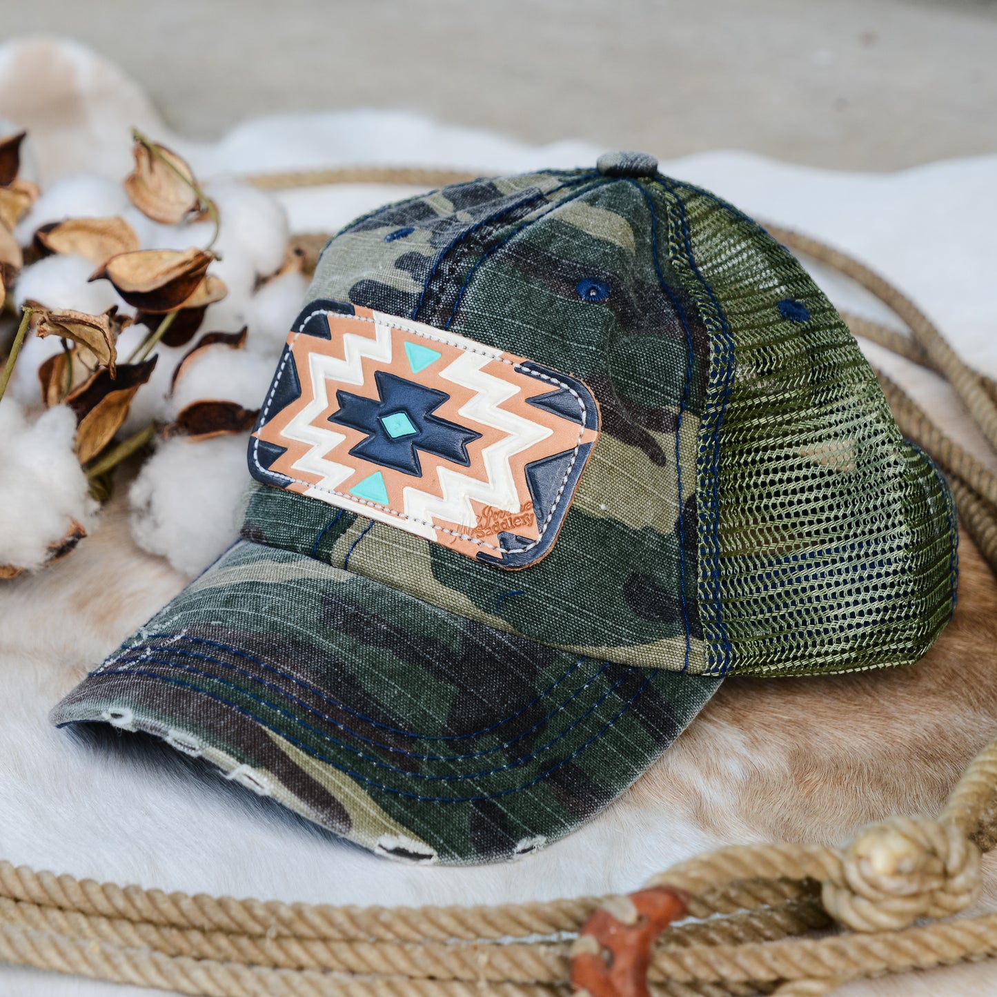McIntire Saddlery Camo Ponytail Cap with Aztec Leather Tooled Patch