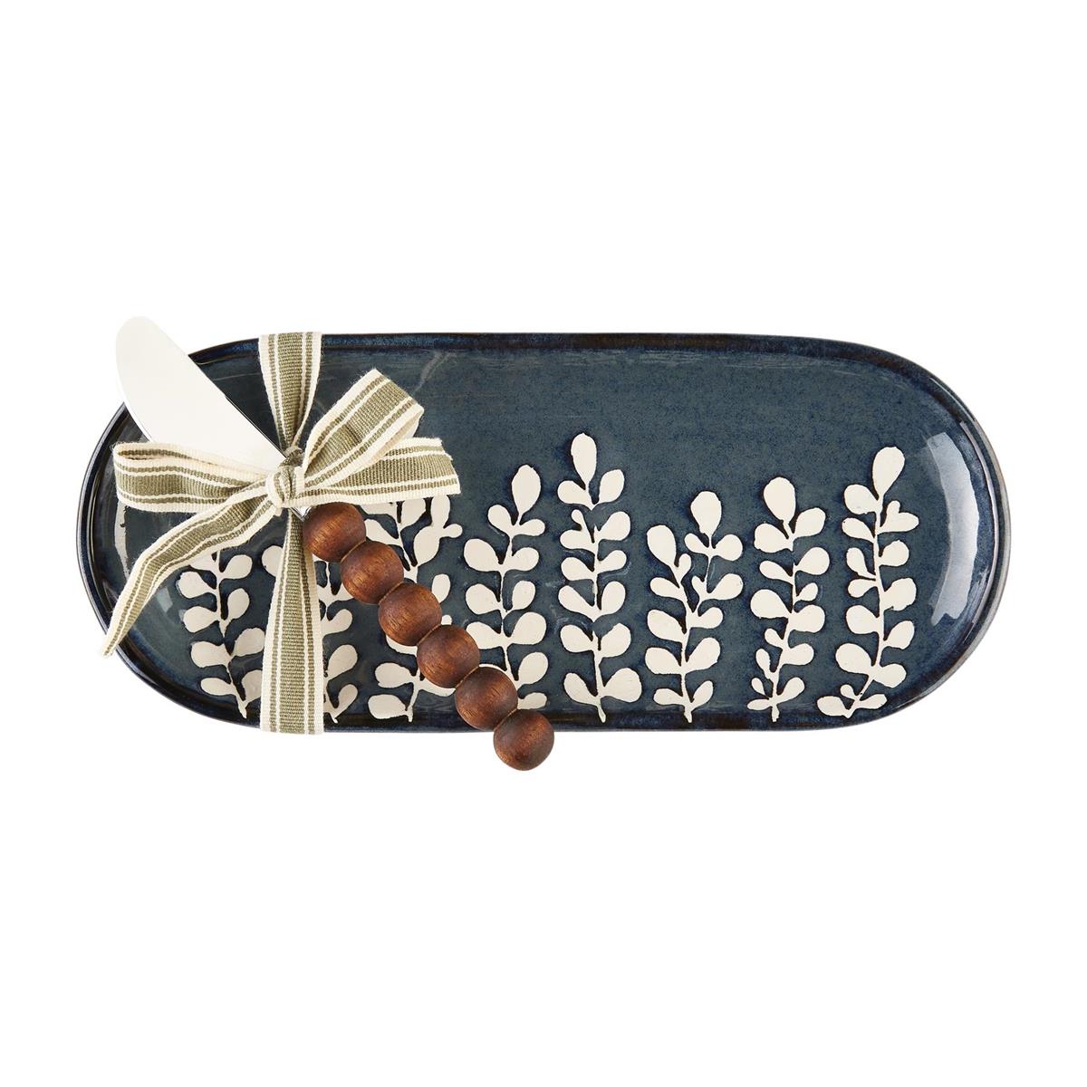 Blue serving dish with white leaf accents