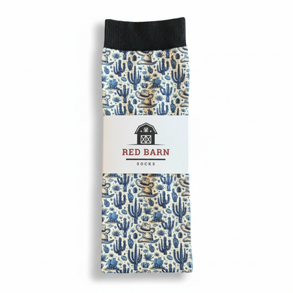 Socks with cactus pattern packaging featuring Red Barn branding on a white background