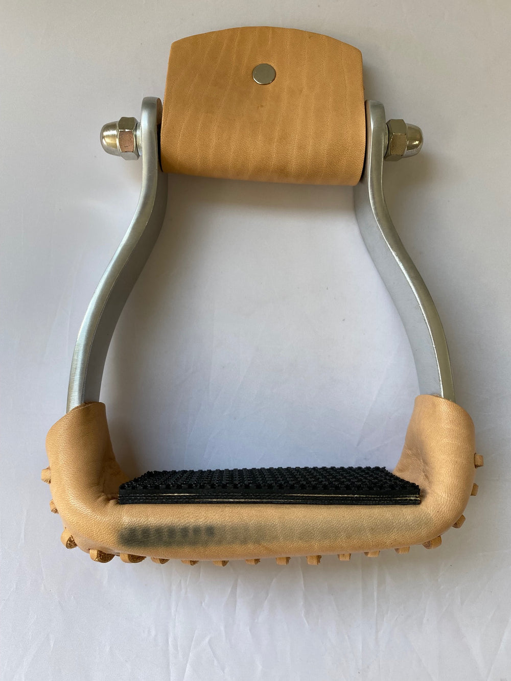 aluminum barrel racing stirrup with leather tread and rubber grip with factory blemish