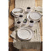 Tablescrape with white stoneware mugs and plates
