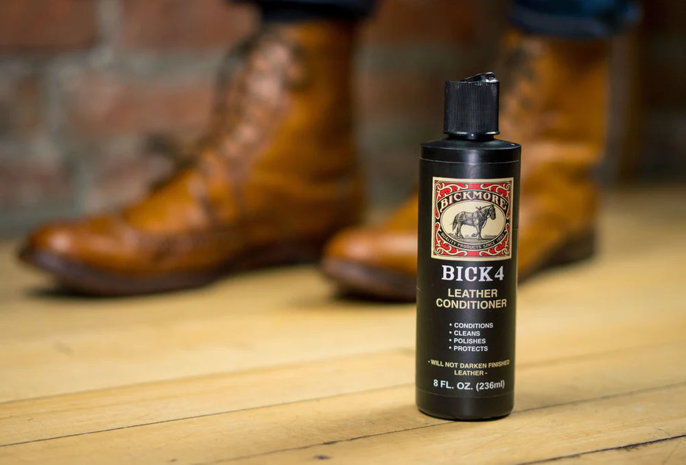 Bick 4 Leather Conditioner - 8oz.bottle in front of a pair of leather boots